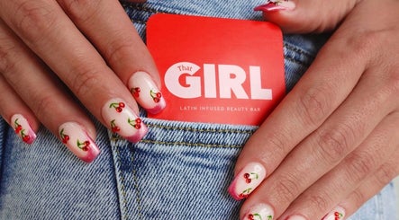 Cherry nail art showcases vibrant creativity at That Girl Beauty Bar, Miami, Florida, US.