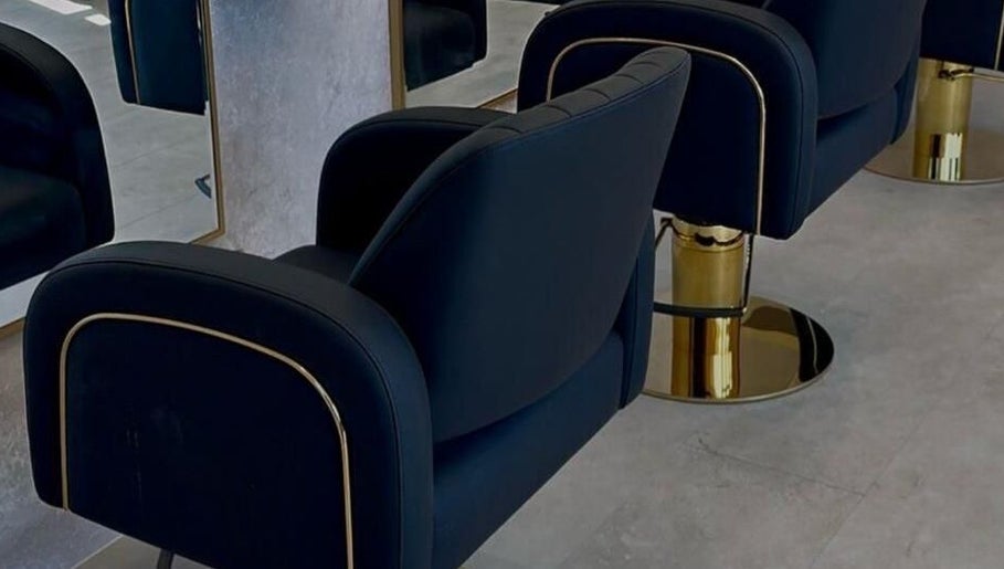 Elegant black salon chairs at Soléa Salon - Emma, Motherwell, Scotland, GB, showcase modern luxury.