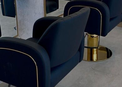 Elegant black salon chairs at Soléa Salon - Emma, Motherwell, Scotland, GB, showcase modern luxury.
