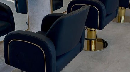 Elegant black salon chairs at Soléa Salon - Emma, Motherwell, Scotland, GB, showcase modern luxury.