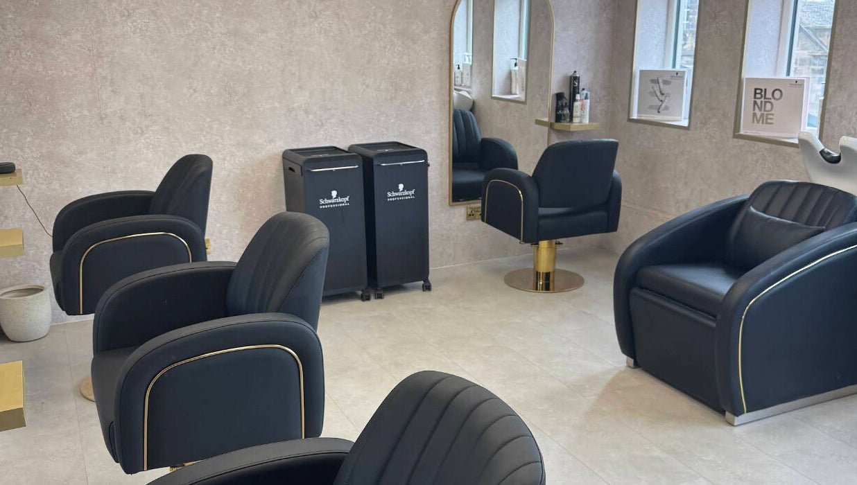 Modern salon interior at Soléa Salon - Emma in Motherwell, Scotland, GB with sleek black chairs and stylish decor.