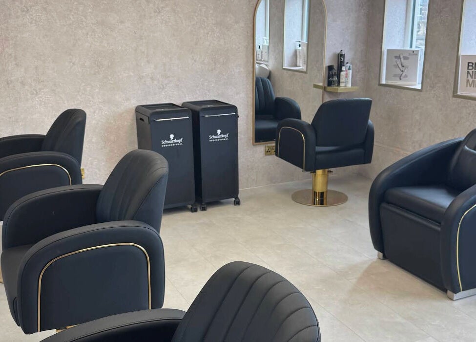 Modern salon interior at Soléa Salon - Emma in Motherwell, Scotland, GB with sleek black chairs and stylish decor.