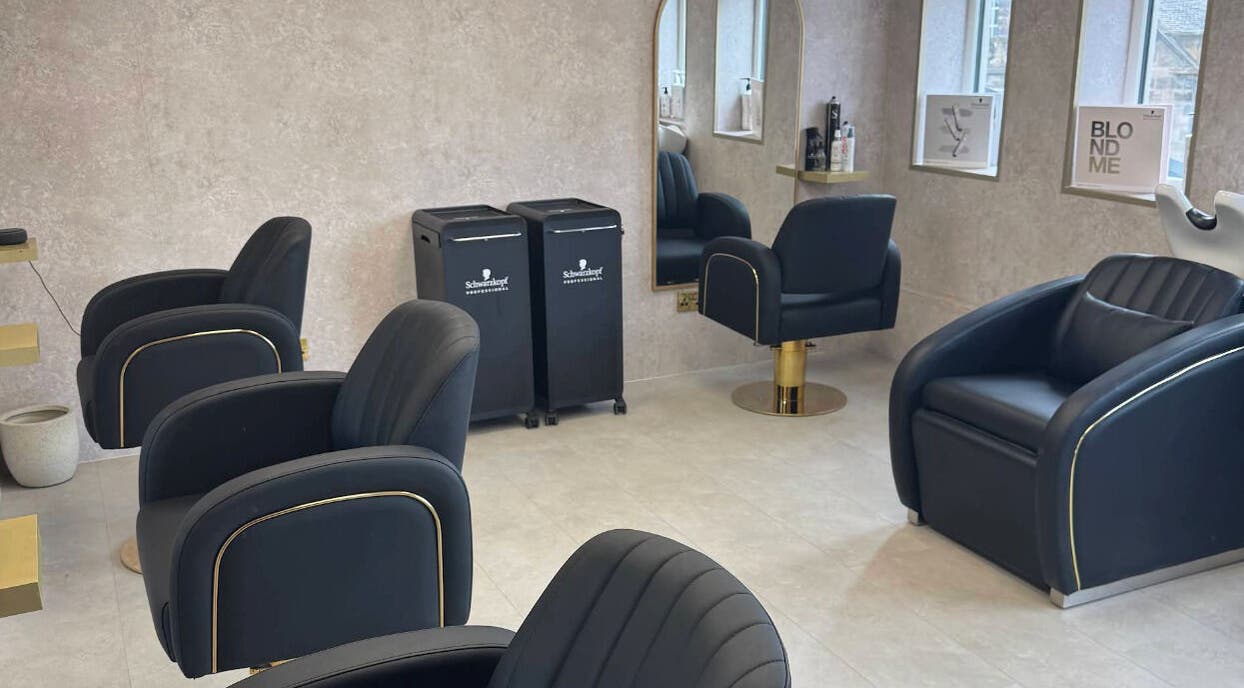 Modern salon interior at Soléa Salon - Emma in Motherwell, Scotland, GB with sleek black chairs and stylish decor.