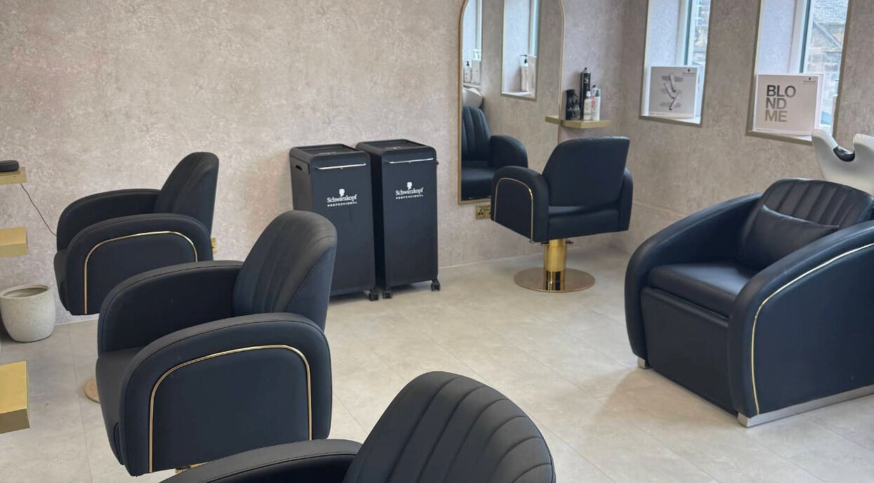 Modern salon interior at Soléa Salon - Emma in Motherwell, Scotland, GB with sleek black chairs and stylish decor.