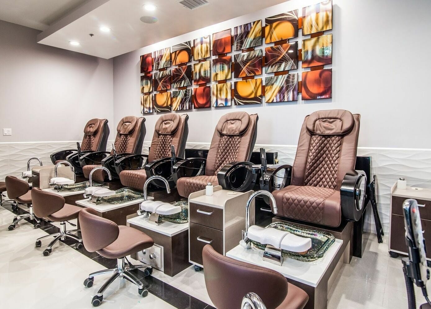 Relaxing pedicure chairs at Glow Spa and Nails in Houston, Texas, US, offering a tranquil spa experience.