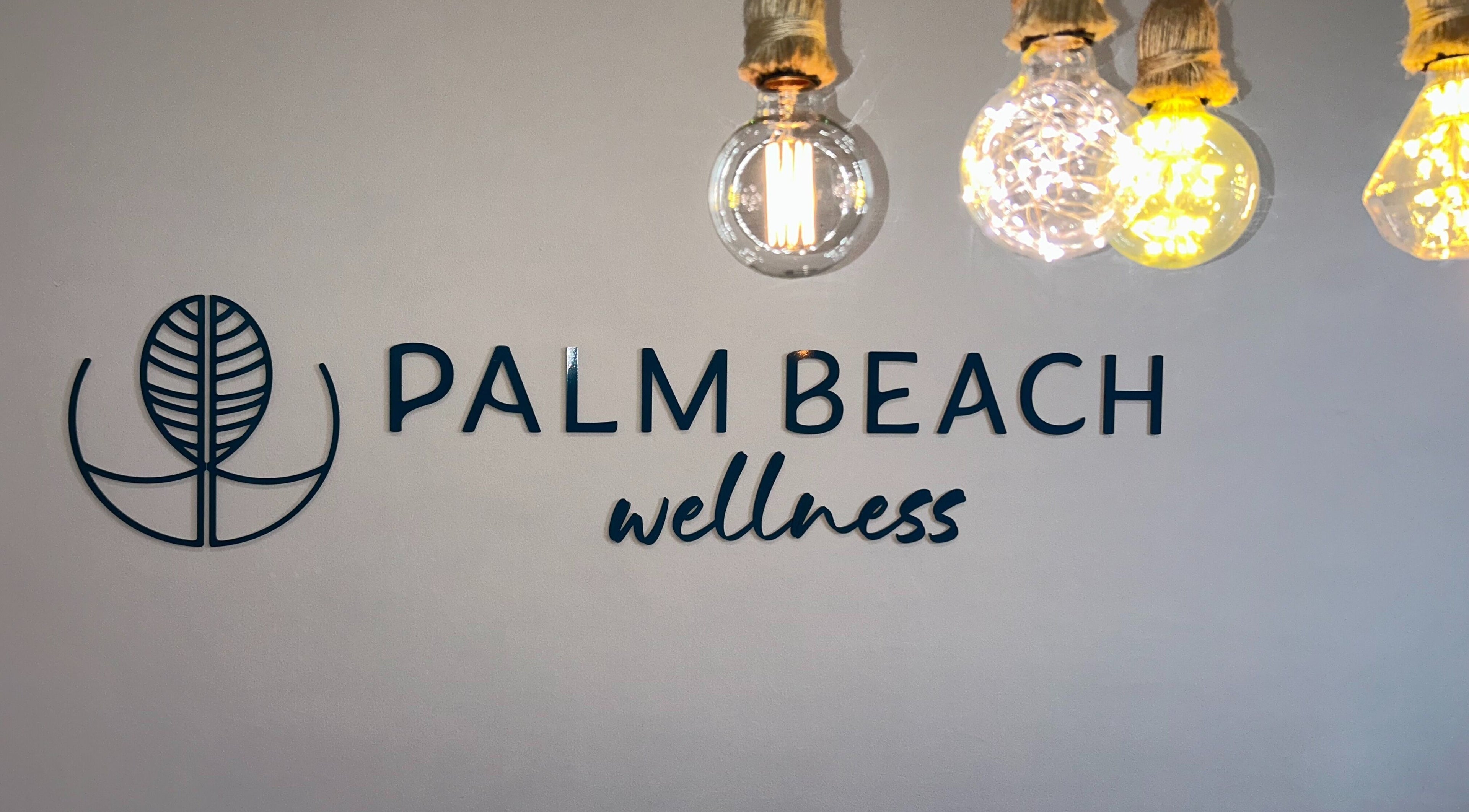 Palm Beach Wellness Nedlands logo with ambient lighting in Nedlands, Western Australia, AU.