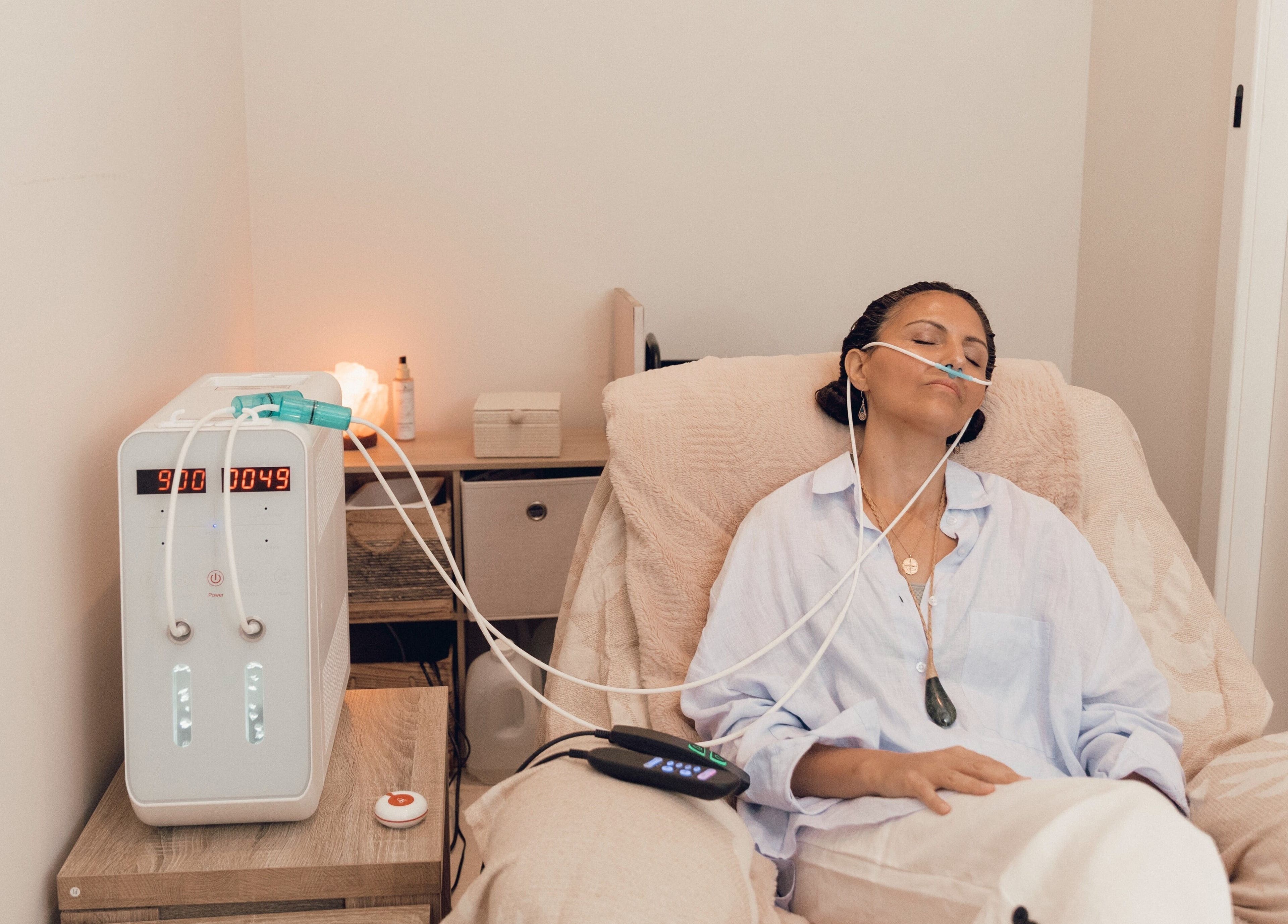 Relaxing oxygen therapy at Palm Beach Wellness Nedlands, Nedlands, Western Australia, AU. Woman enjoys rejuvenation.