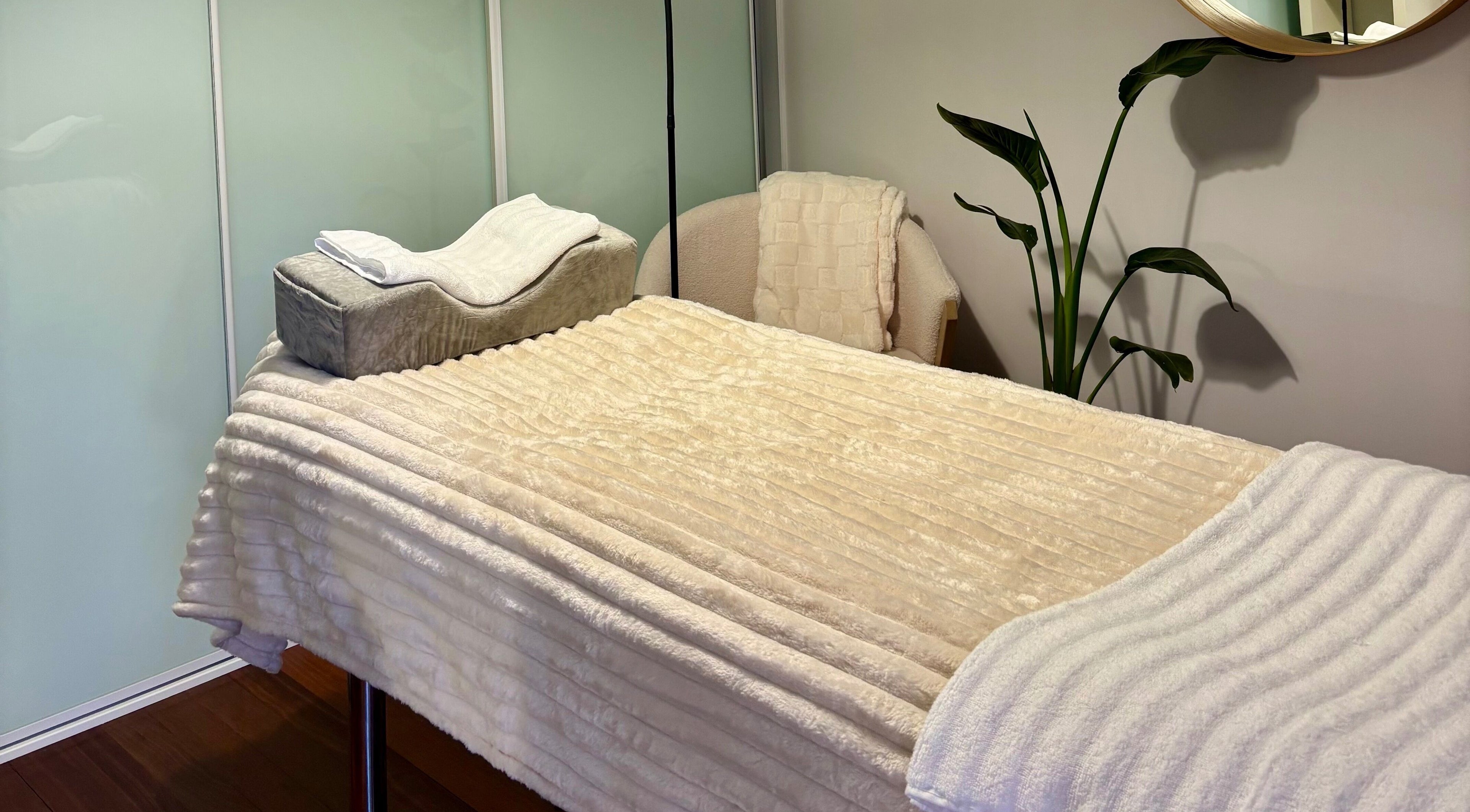 Inviting therapy bed at Studio CB in Mount Lawley, Western Australia, AU, ready for a soothing session.