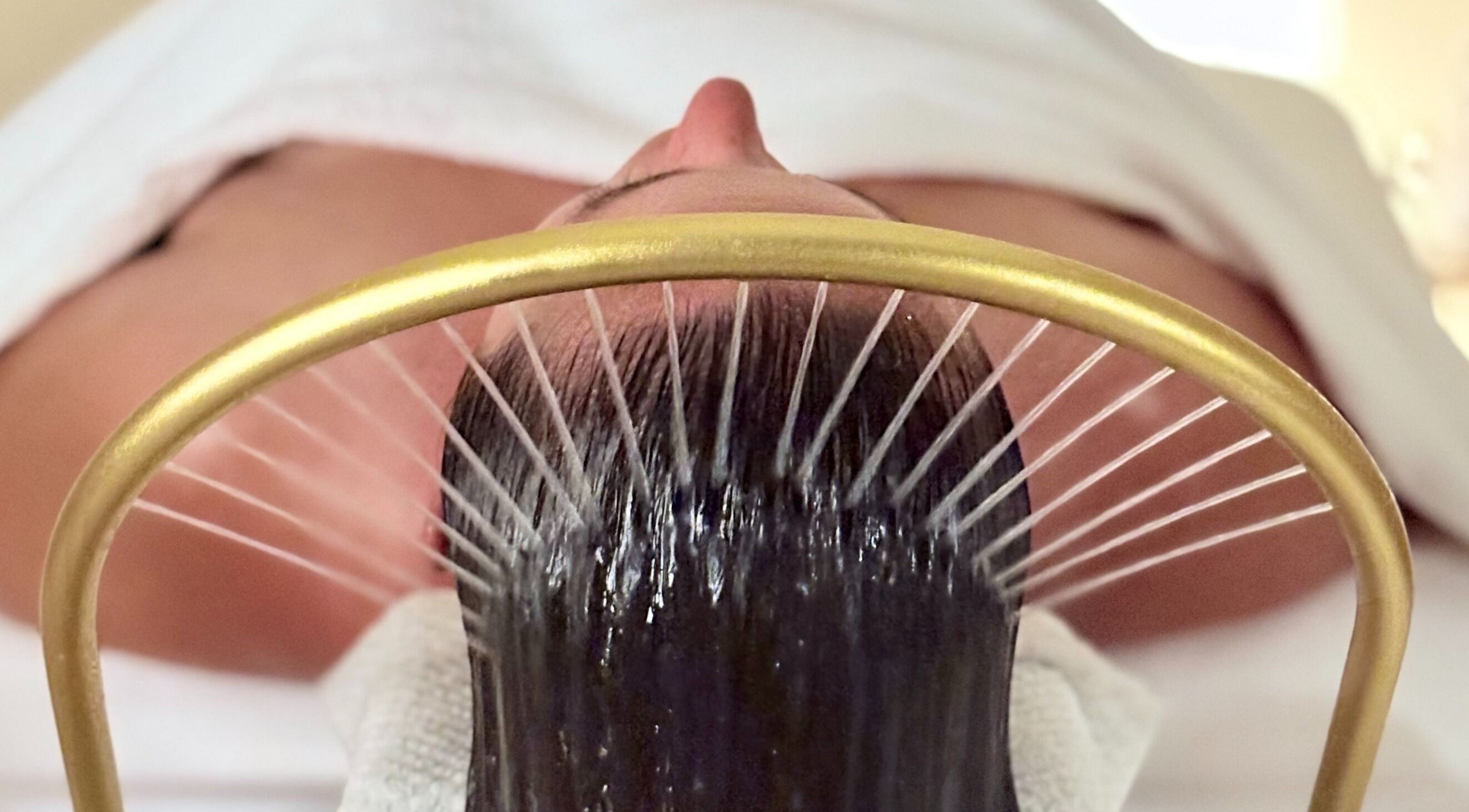 Relaxing head treatment at ILO Head Spa, Lewes, England, GB with soothing water therapy for hair wellness.