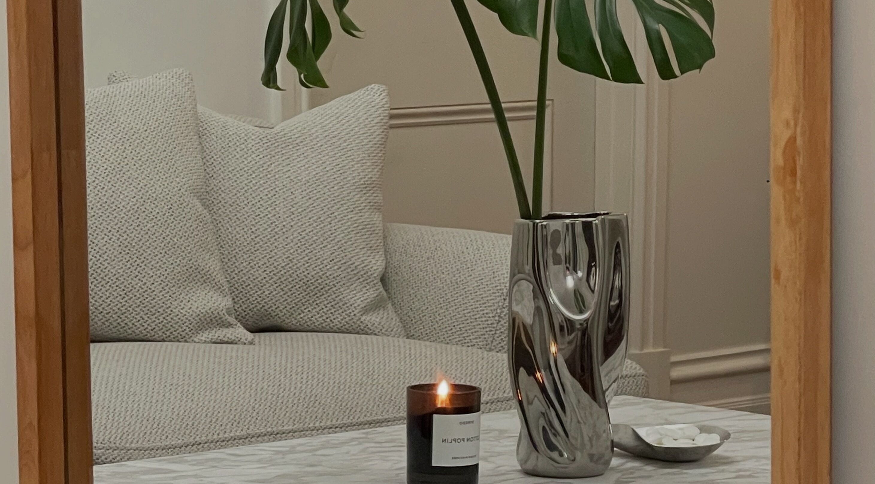 Modern vase and candle setting at DermaSkin, Melbourne, Victoria, AU reflecting cozy ambiance.