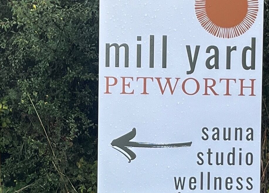 Mill Yard Petworth sauna studio wellness sign at Slow it down holistic therapies, Petworth, England, GB.