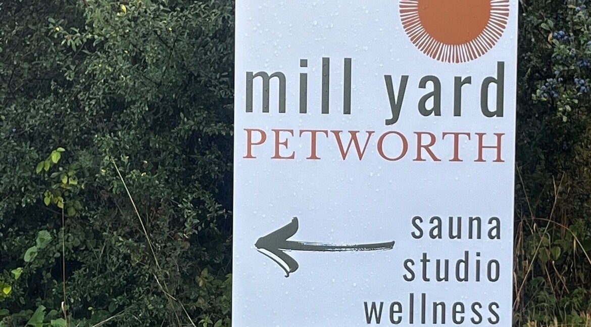 Mill Yard Petworth sauna studio wellness sign at Slow it down holistic therapies, Petworth, England, GB.