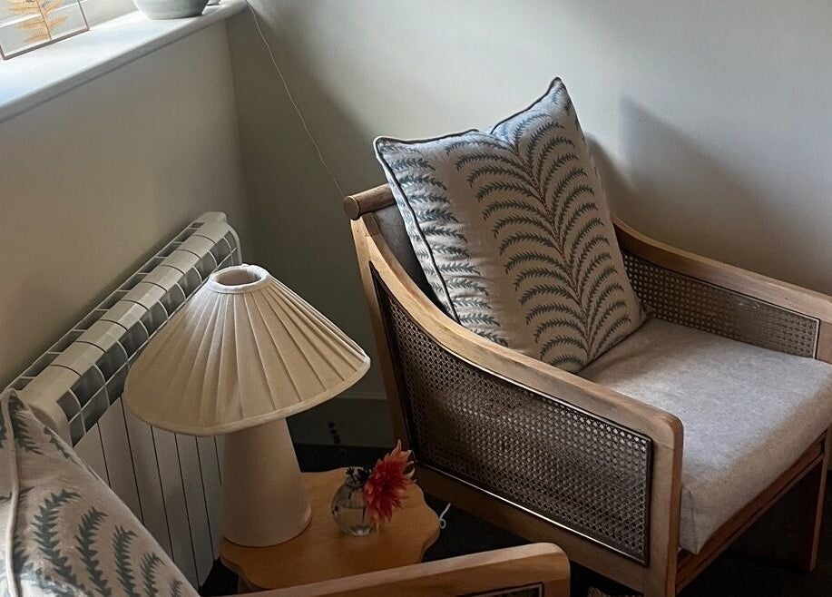 Comfortable seating at Slow it down holistic therapies in Petworth, England, GB with soft lighting and decor.