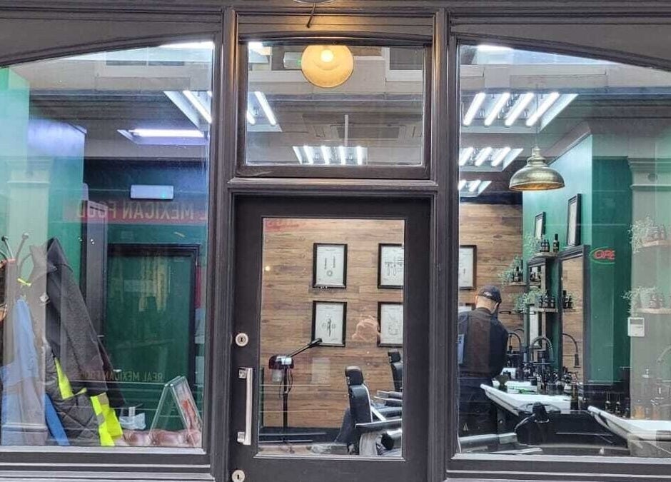 Front view of Mane Man Grooming Ltd in London, England, GB showcasing stylish interior with barber chairs and decor.