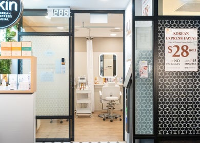 Entrance to Kskin Korean Express Facial - Chinatown Point, Singapore, SG with inviting decor and treatment area visible.