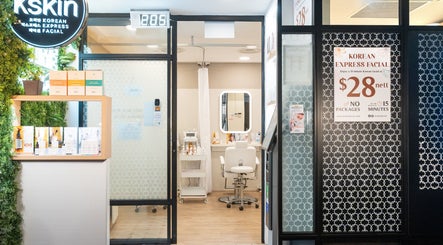 Entrance to Kskin Korean Express Facial - Chinatown Point, Singapore, SG with inviting decor and treatment area visible.