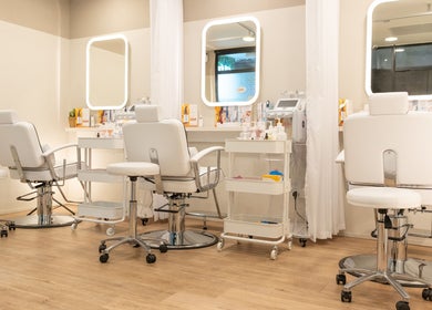 Elegant interior of Kskin Korean Express Facial - Chinatown Point, Singapore, SG with white chairs and mirrors.