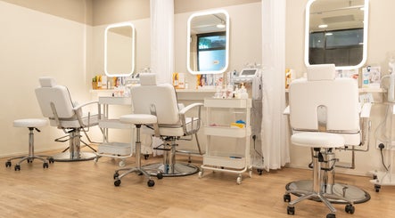 Elegant interior of Kskin Korean Express Facial - Chinatown Point, Singapore, SG with white chairs and mirrors.