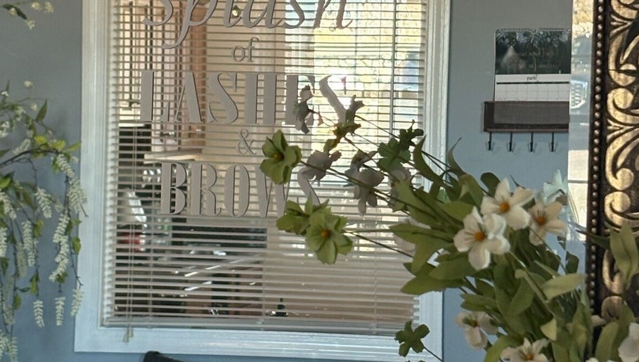 Entrance of Splash of Lashes with floral decor in Woonsocket, Rhode Island, US.