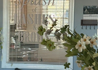 Entrance of Splash of Lashes with floral decor in Woonsocket, Rhode Island, US.