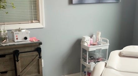 Tranquil treatment room at Splash of Lashes, Woonsocket, Rhode Island, US, showcasing spa essentials.