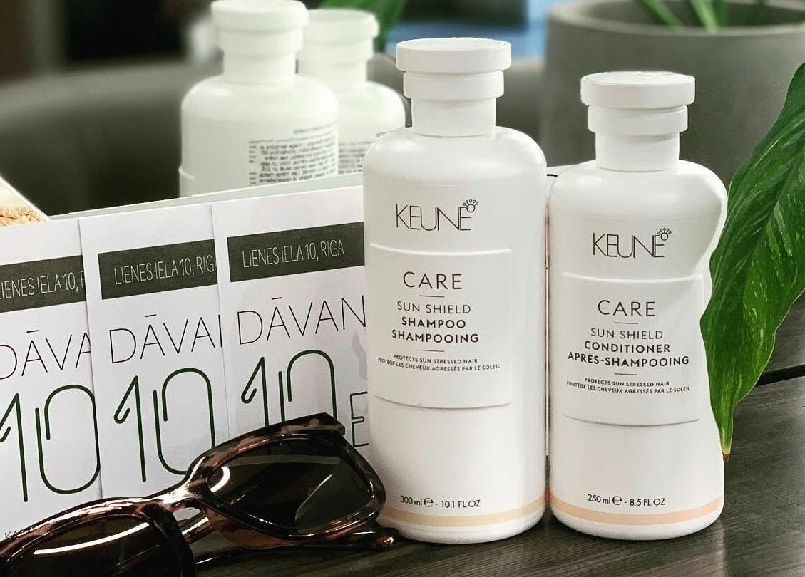 Hairport Studija's Keune products and brochure in Rīga, LV showcasing luxury haircare essentials.