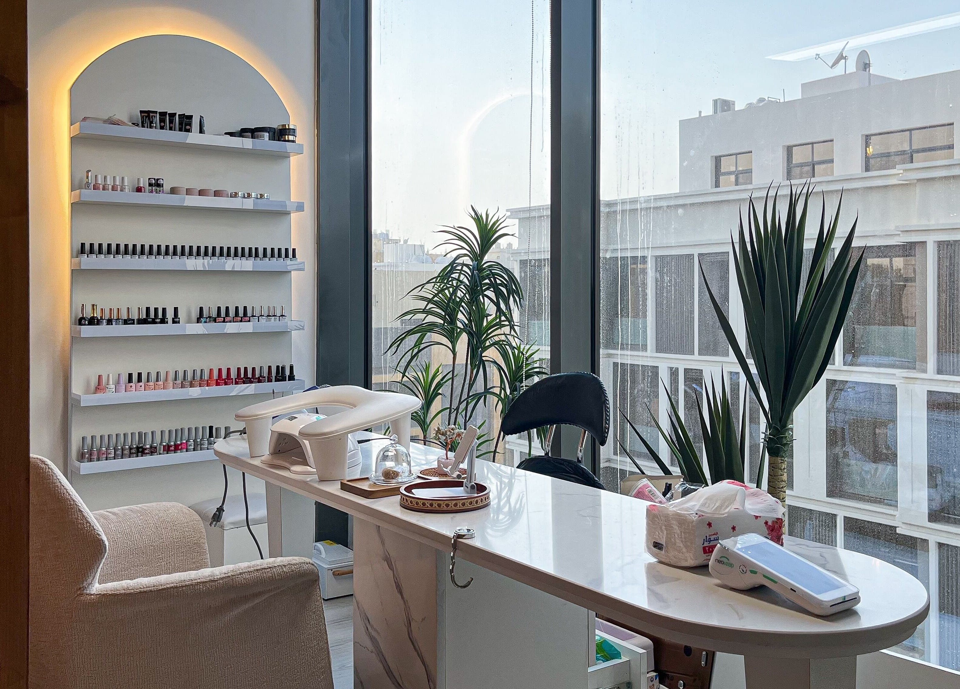 Mona Beauty's serene nail studio in Jeddah, Makkah Province, SA with modern decor and city views.