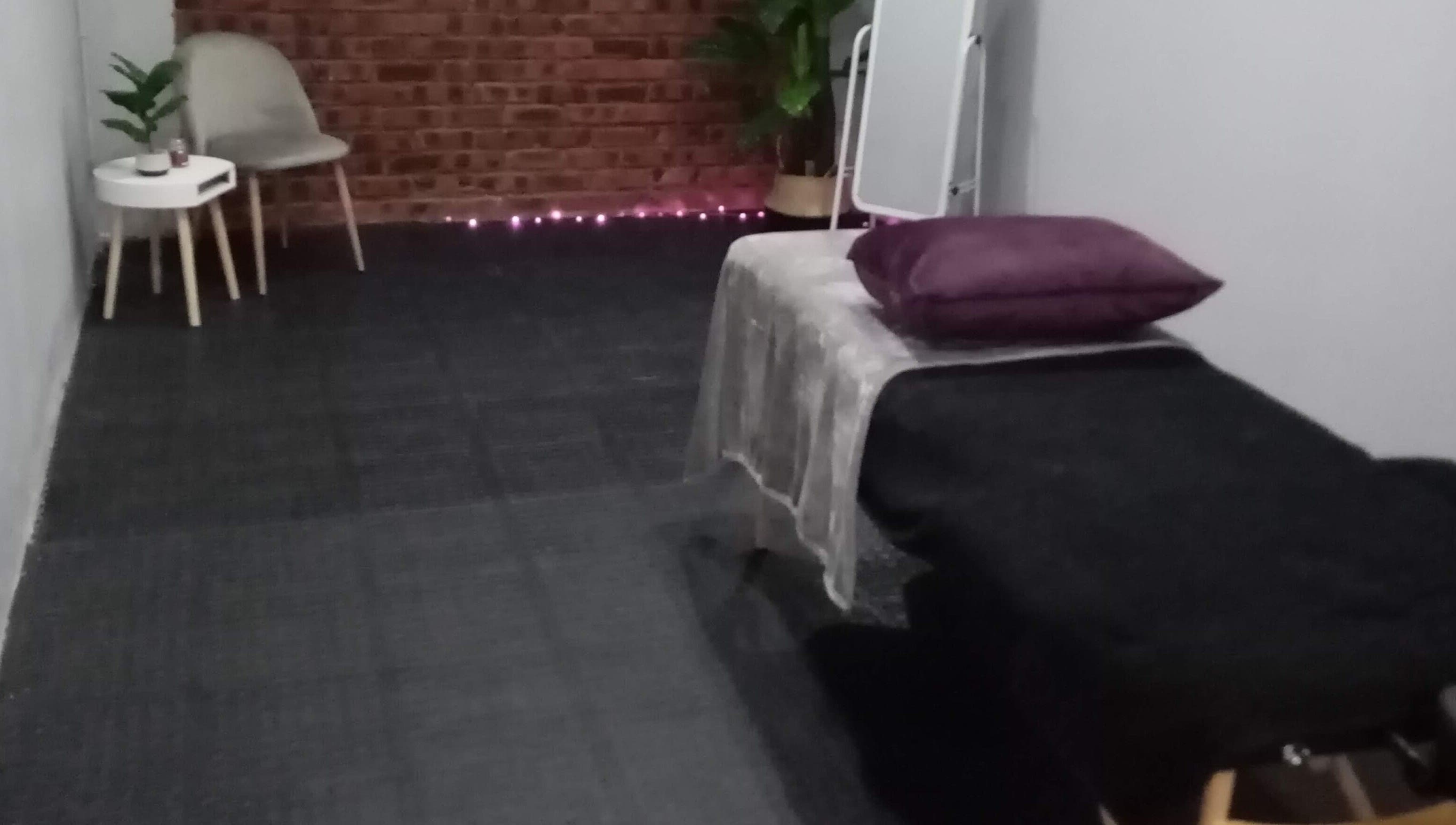 Elegant treatment room at Lashinc Lash Artistry, Durban, Kwazulu-natal, ZA, with a cozy chair and soft lighting.