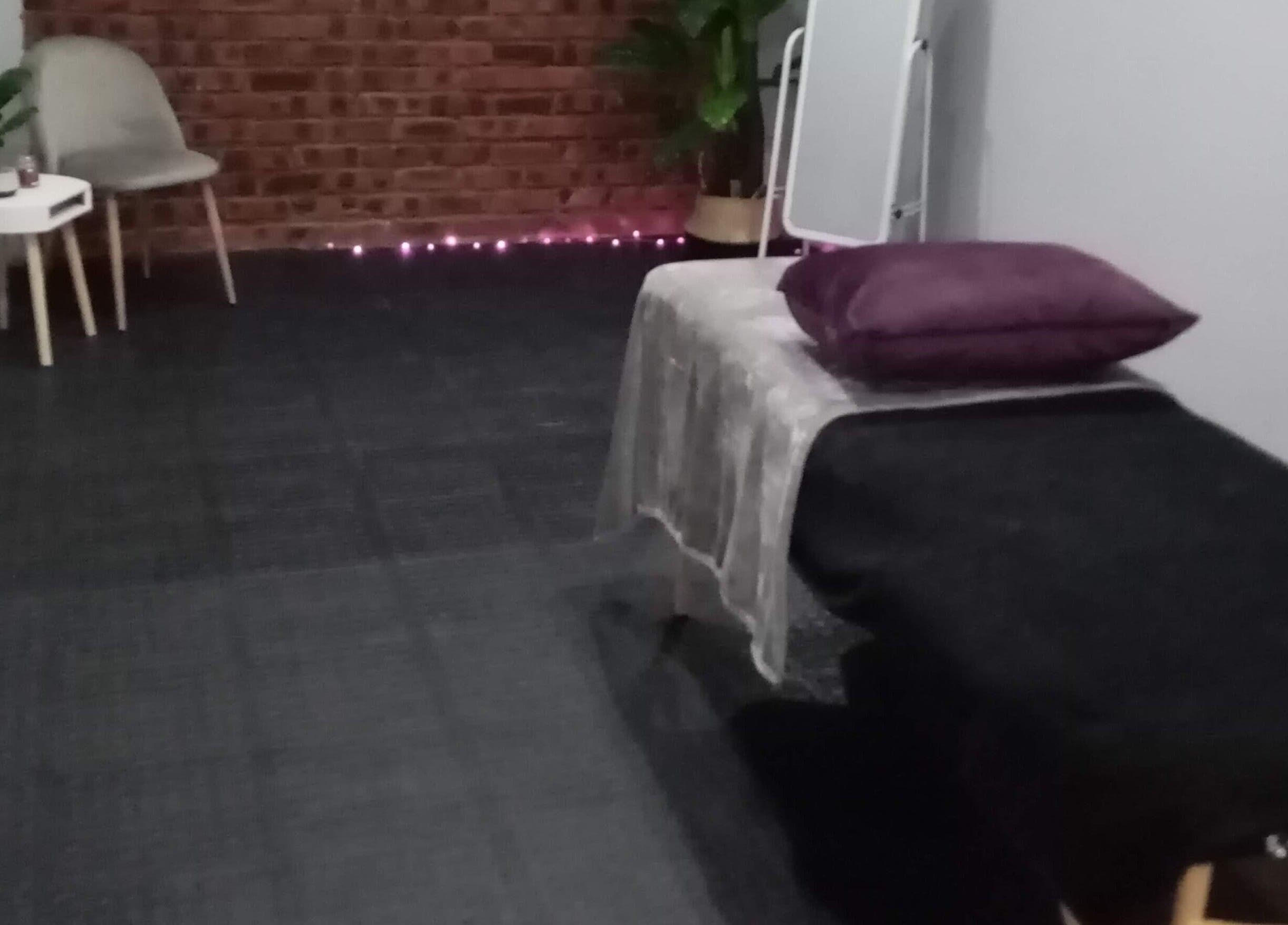 Elegant treatment room at Lashinc Lash Artistry, Durban, Kwazulu-natal, ZA, with a cozy chair and soft lighting.