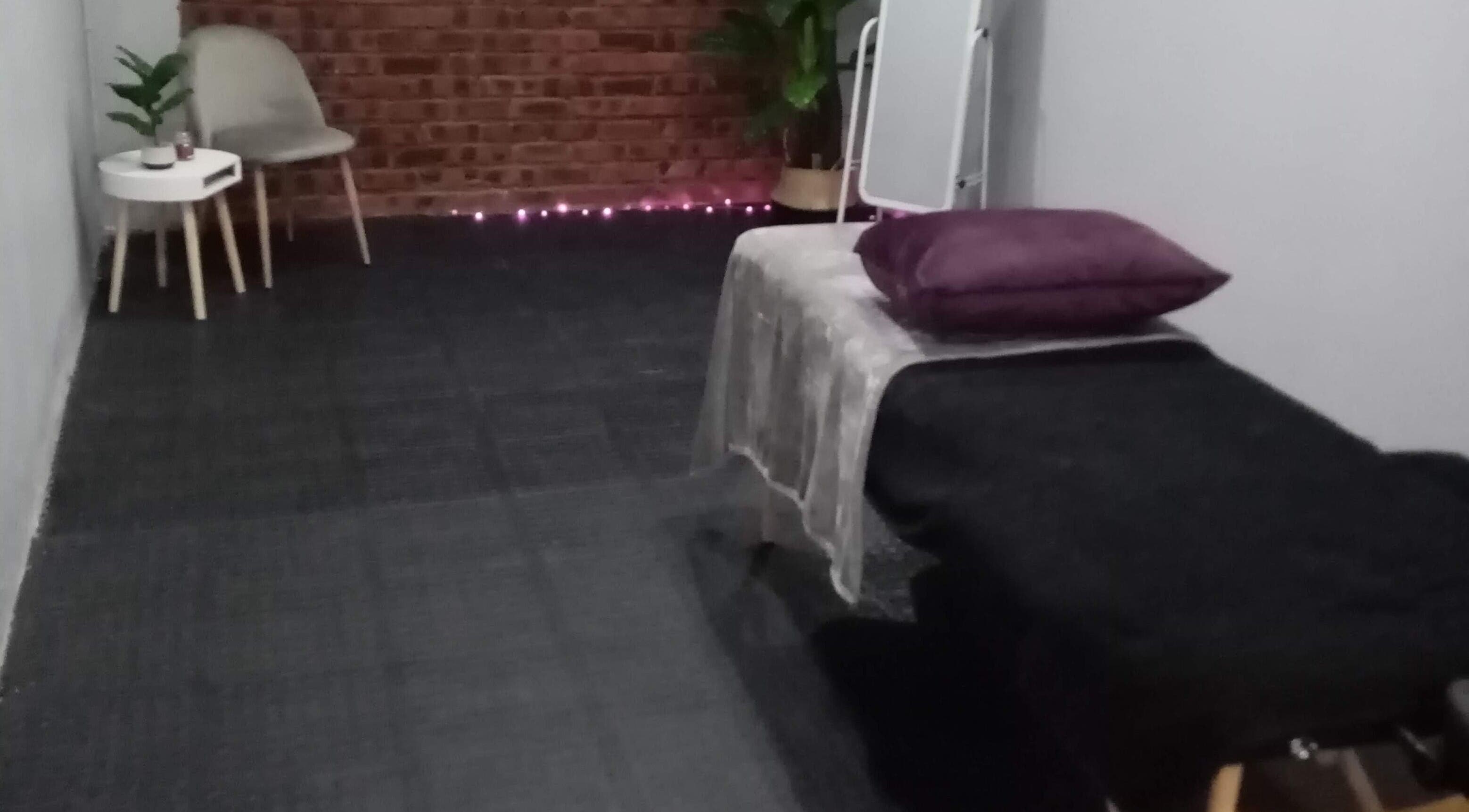 Elegant treatment room at Lashinc Lash Artistry, Durban, Kwazulu-natal, ZA, with a cozy chair and soft lighting.