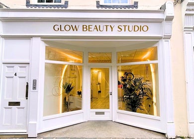 Front view of Glow Beauty Studio in Guernsey, Saint Peter Port, GG adorned with plants and warm lighting.