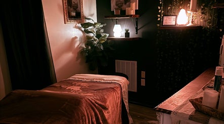 Tranquil massage room at Crystal Hayden LMT in Greer, South Carolina, US, featuring cozy lighting and decor.