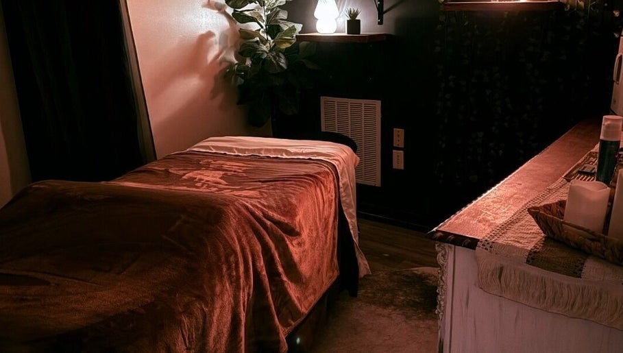 Tranquil massage room at Crystal Hayden LMT in Greer, South Carolina, US with cozy lighting and decor.