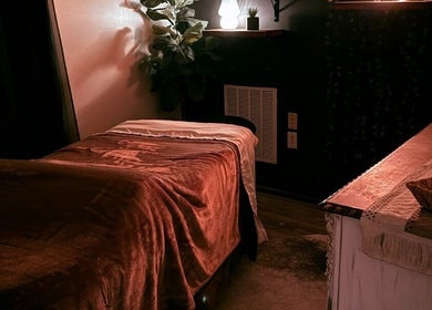 Tranquil massage room at Crystal Hayden LMT in Greer, South Carolina, US with cozy lighting and decor.