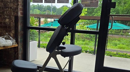 Massage chair in tranquil setting at Crystal Hayden LMT, Greer, South Carolina, US, near large window view.