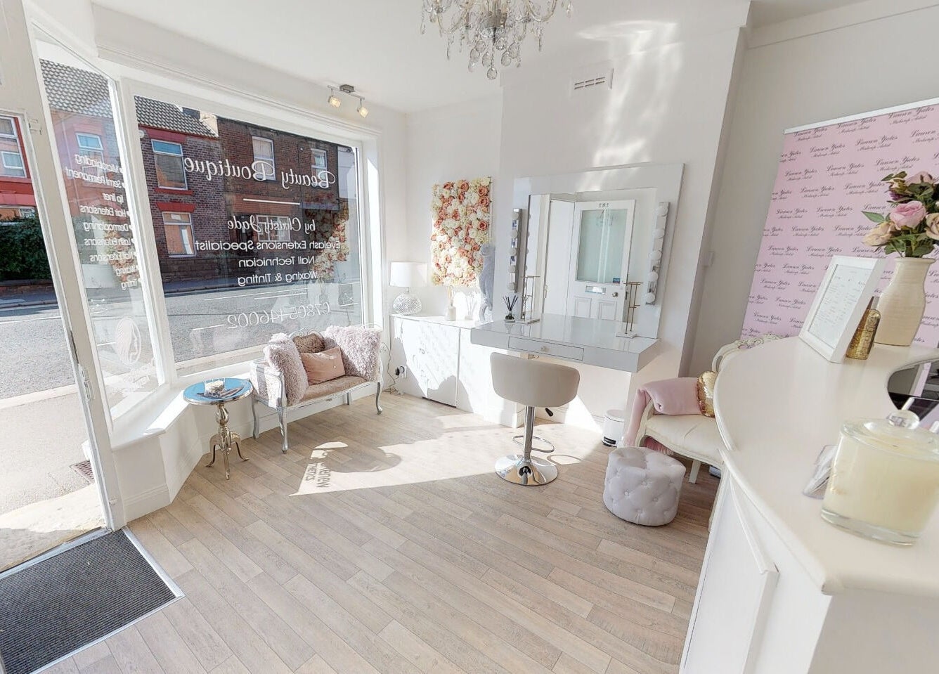 Elegant interior of Makeup By Ruby, Chesterfield, England showcasing a chic beauty station and seating area.