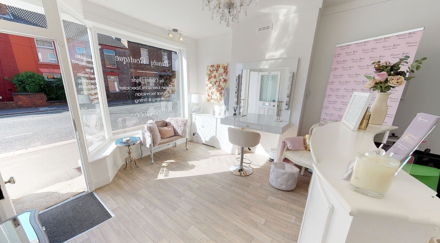 Elegant interior of Makeup By Ruby, Chesterfield, England showcasing a chic beauty station and seating area.