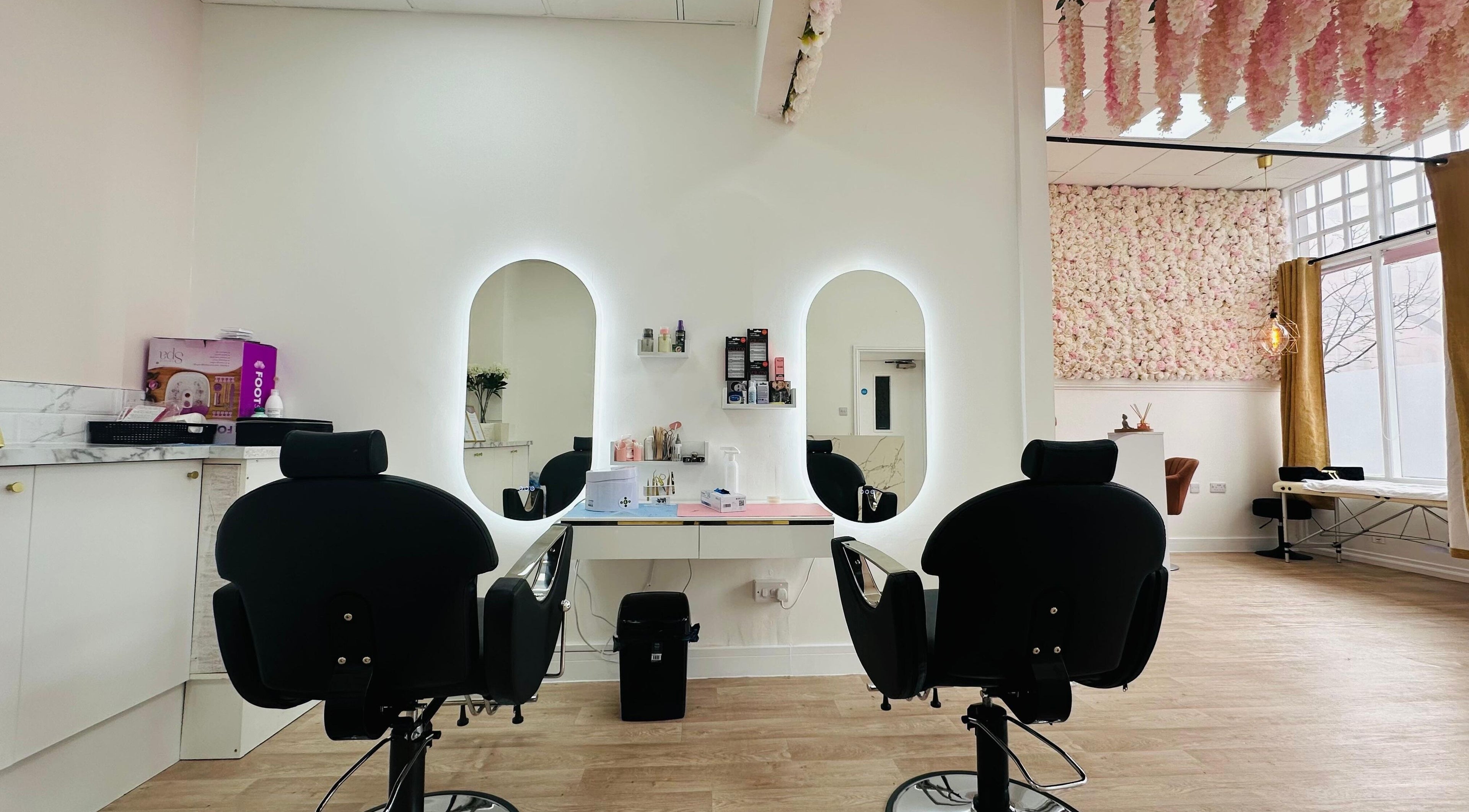 Modern styling chairs with illuminated mirrors at Elegance Touch Nails & Beauty Salon, Hartlepool, England, GB.