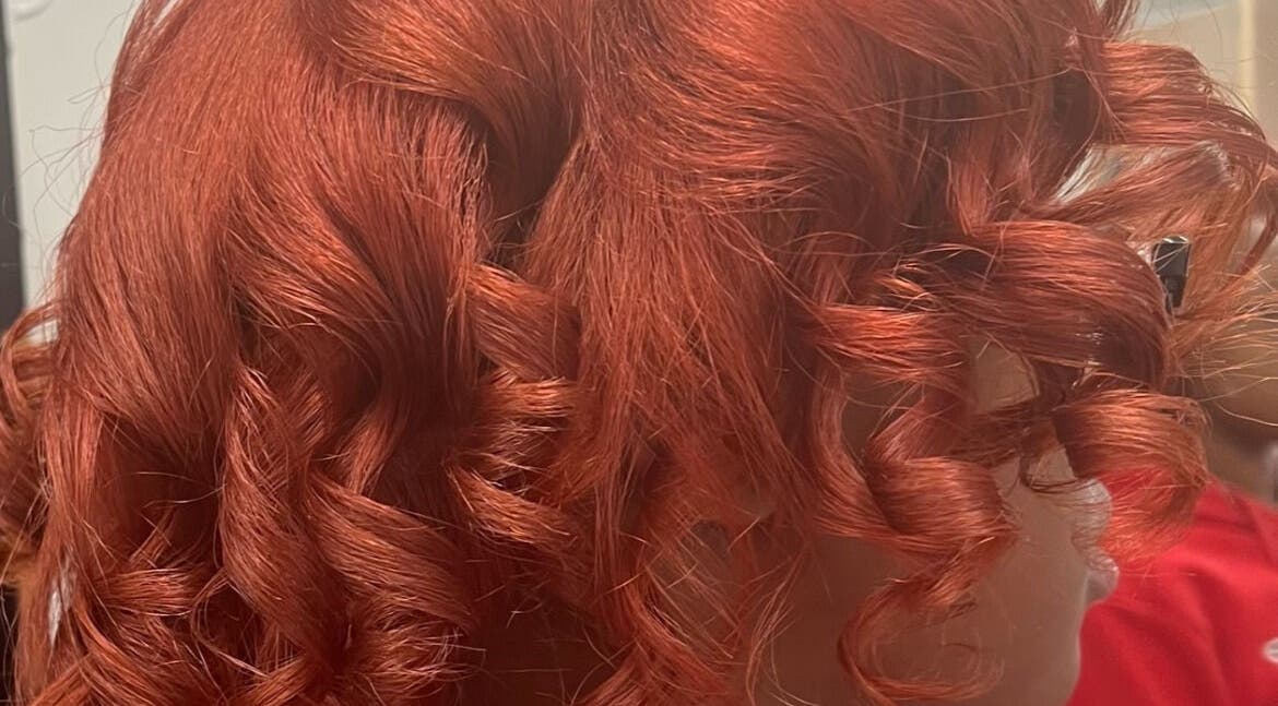 Vibrant red curls styled at Tasja’s Style Studio in Madison, Wisconsin, US.