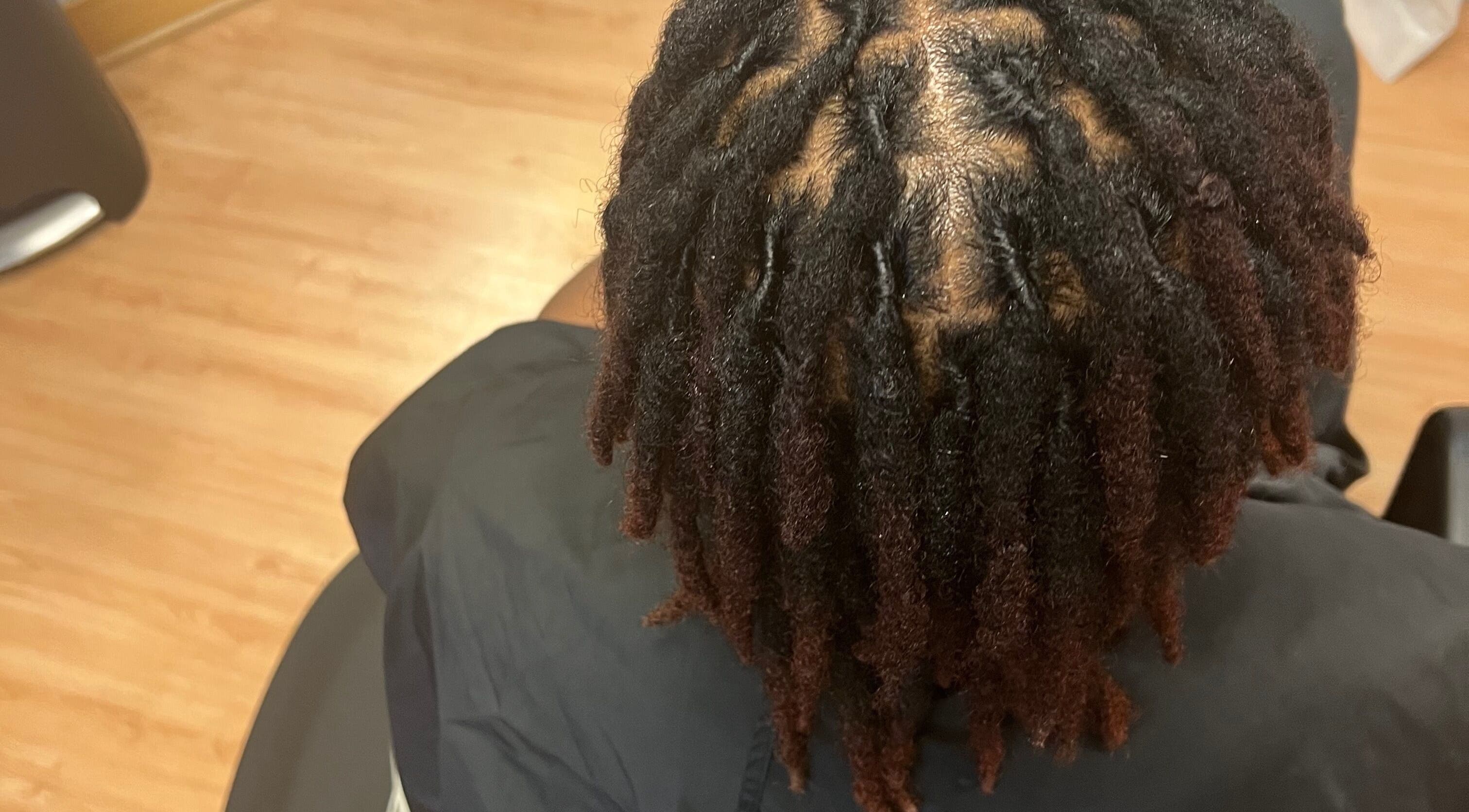 Intricate dreadlocks styled at Tasja’s Style Studio, Madison, Wisconsin, US.