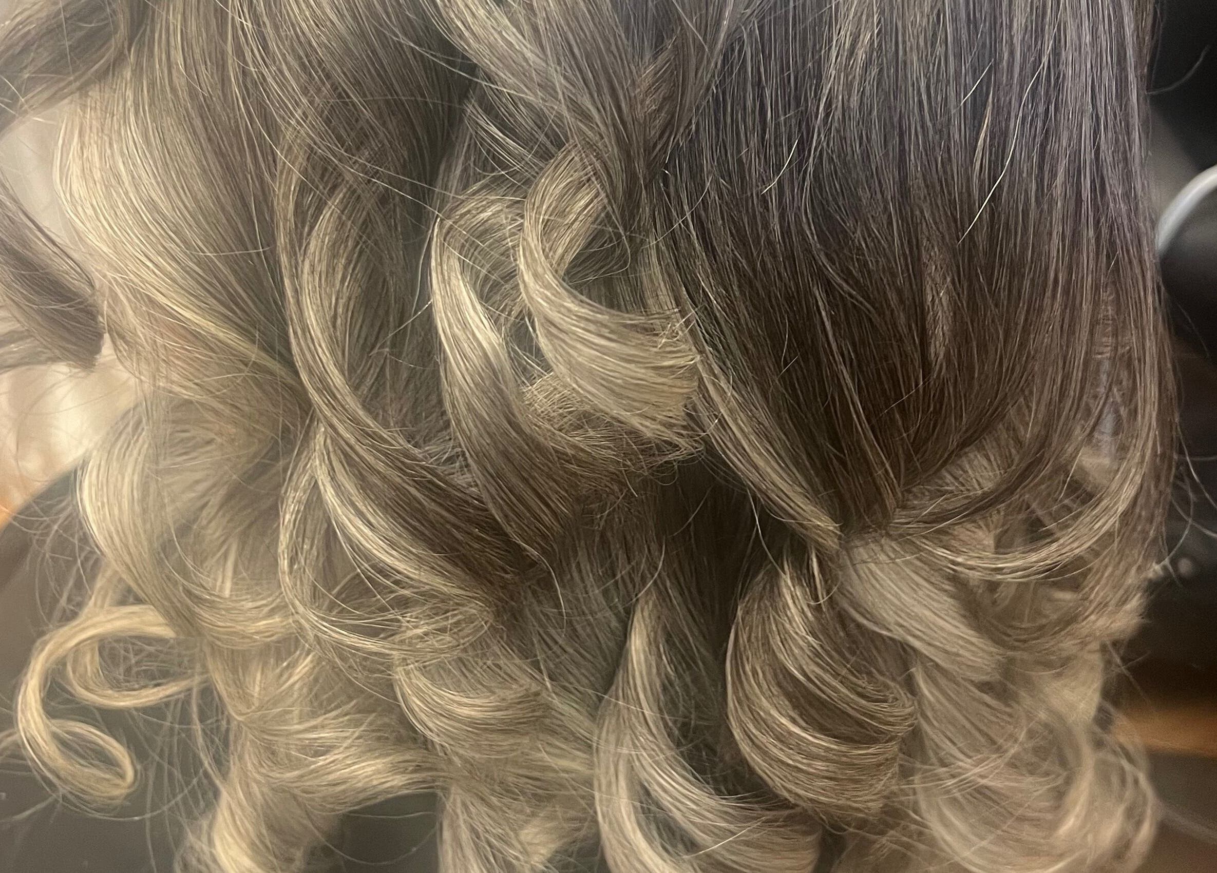 Close-up of beautifully curled hair styled at Tasja’s Style Studio, Madison, Wisconsin, US.