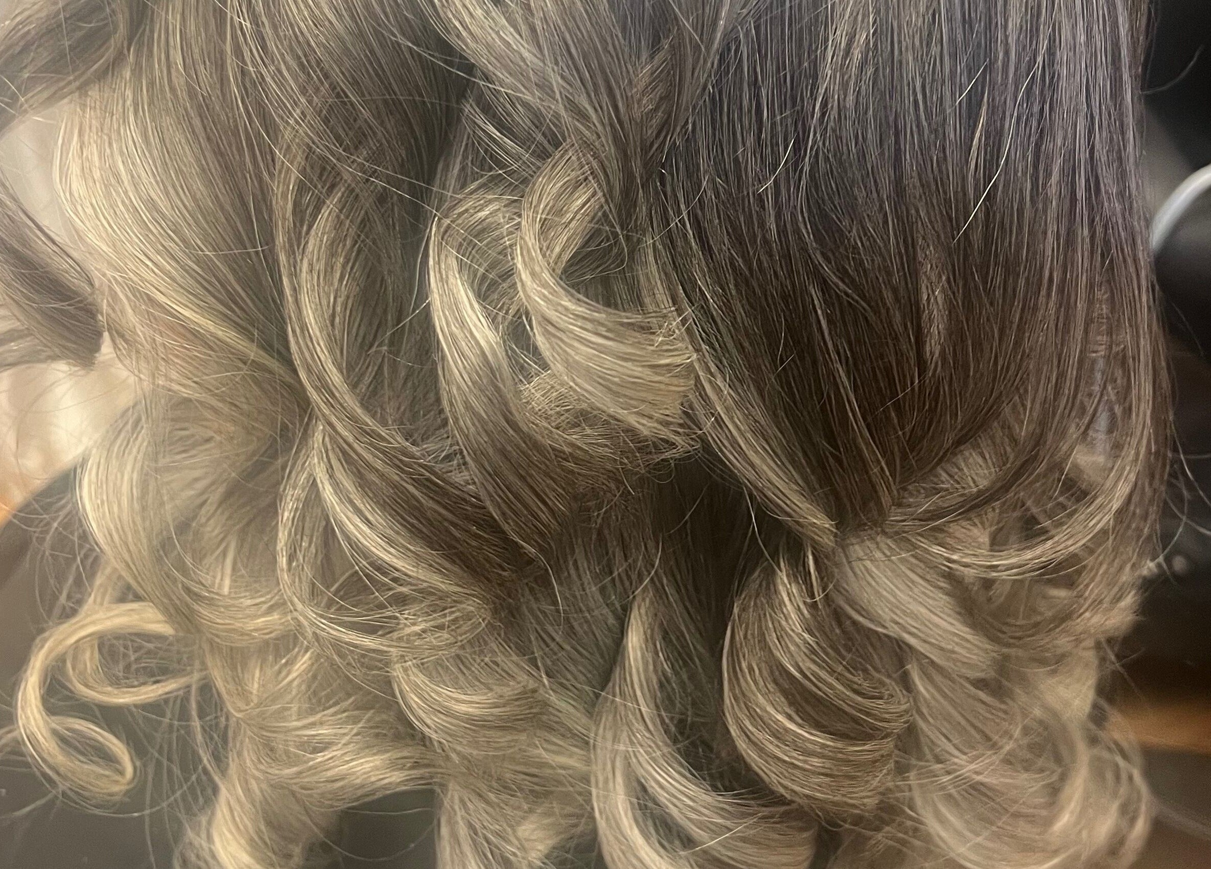 Close-up of beautifully curled hair styled at Tasja’s Style Studio, Madison, Wisconsin, US.