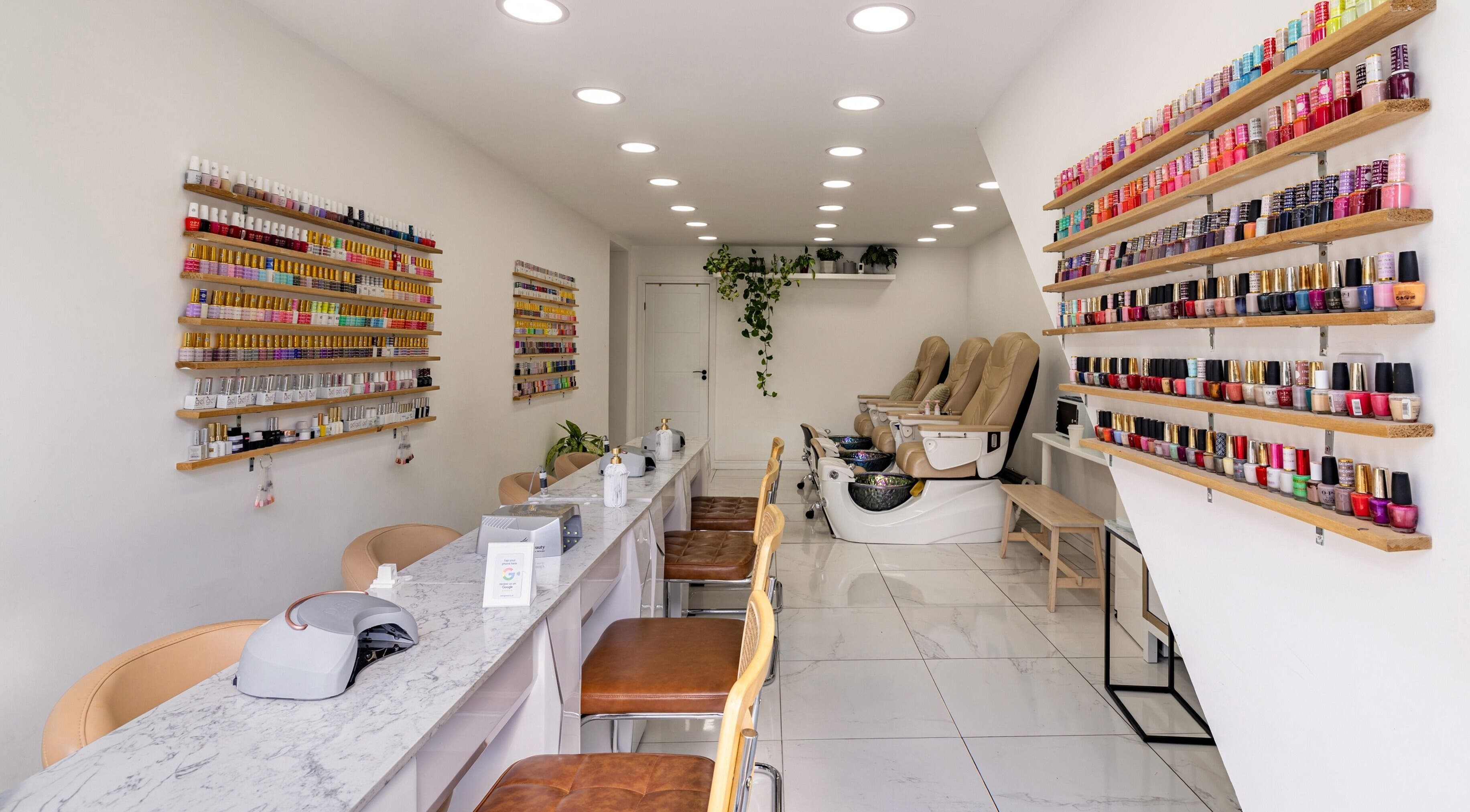 Beauty Talk's elegant nail salon in Richmond, England, GB with vibrant polish displays and cozy seating.
