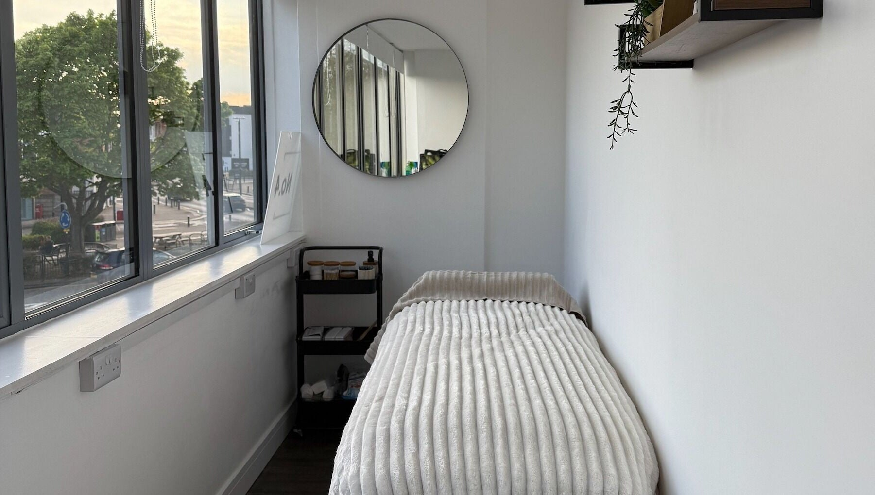 A cozy treatment room with a soft bed at Beauty by González, West Bridgford, England, GB.