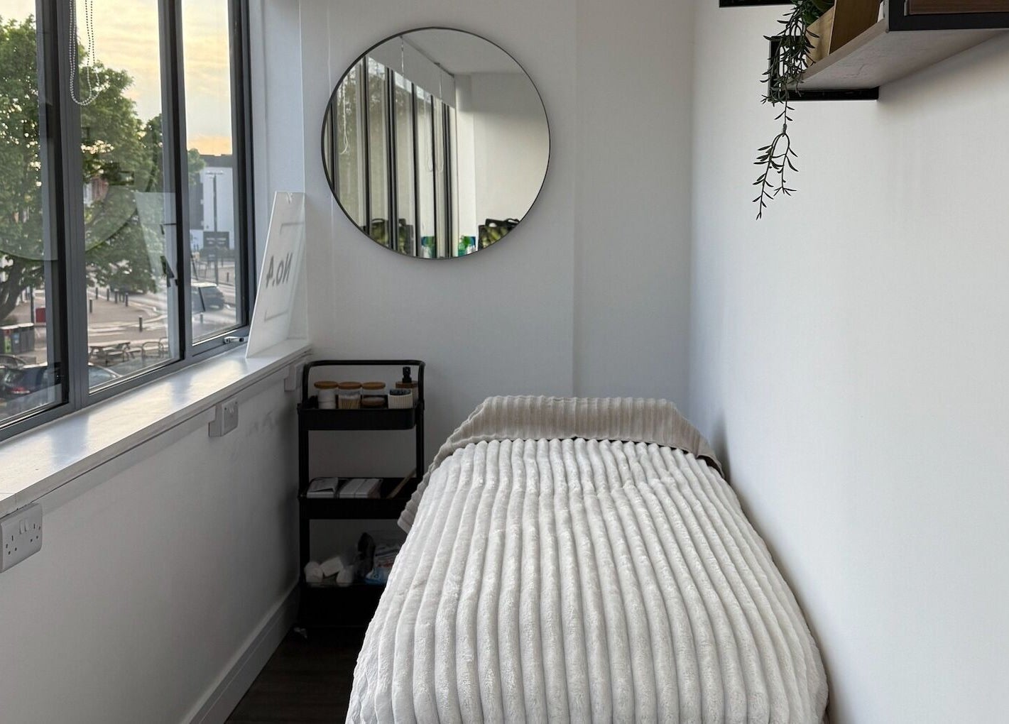 A cozy treatment room with a soft bed at Beauty by González, West Bridgford, England, GB.