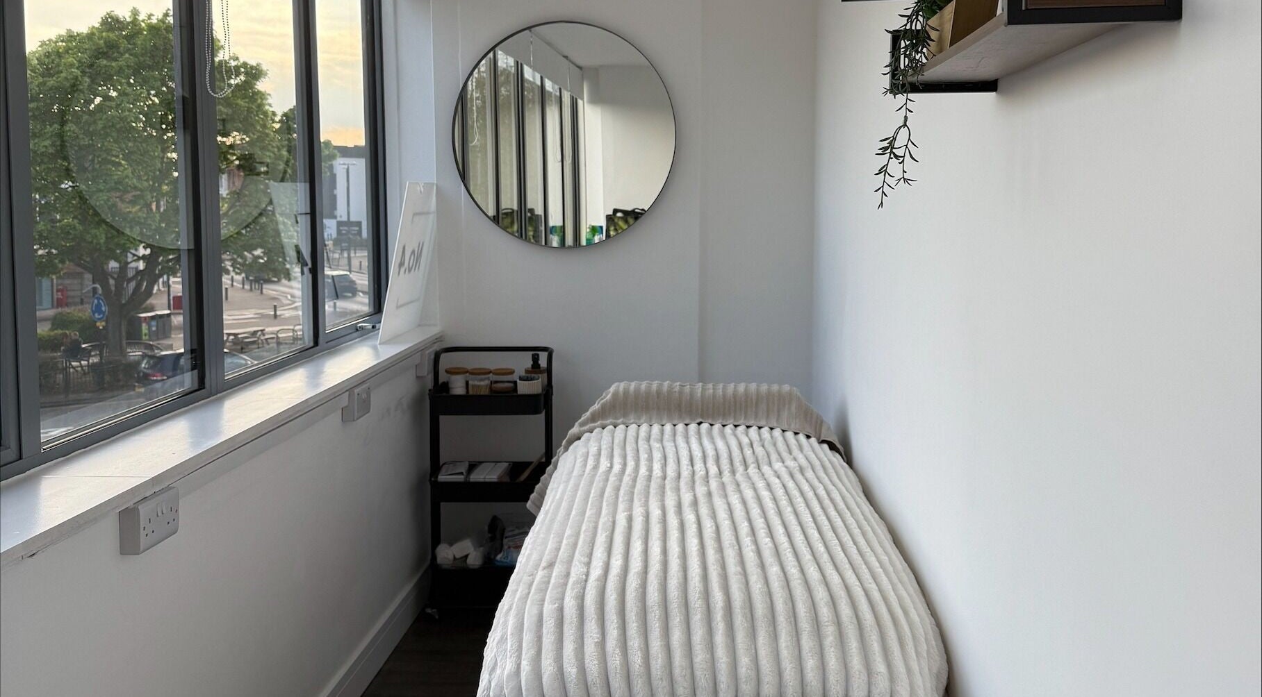 A cozy treatment room with a soft bed at Beauty by González, West Bridgford, England, GB.