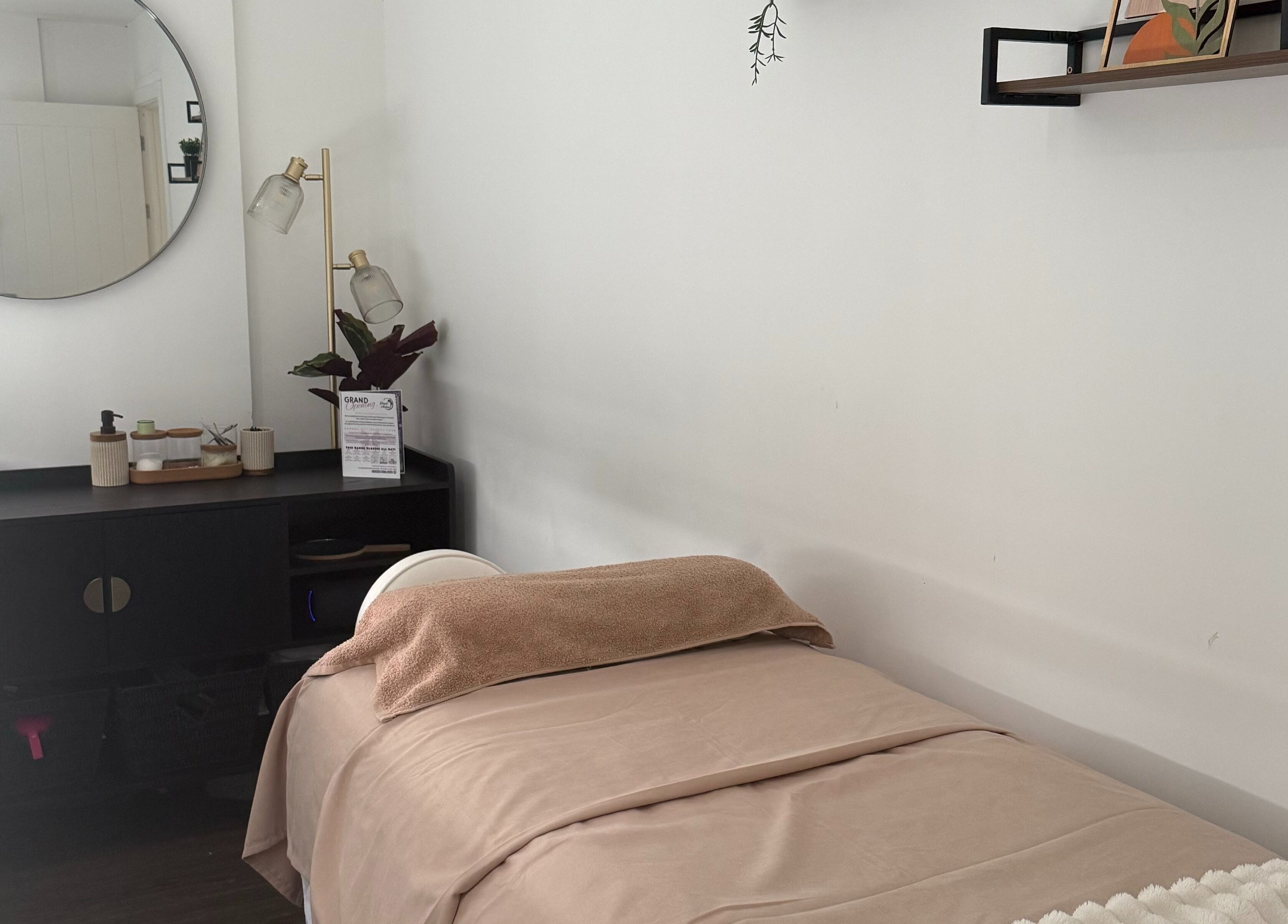 Tranquil spa room at Beauty by González, West Bridgford, England, GB with a treatment bed and elegant decor.