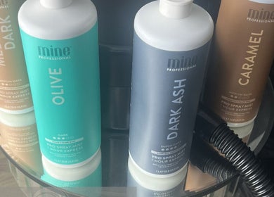 Tanning products at Glo Luxe Studios in Crowborough, England, enhancing beauty with rich colors.