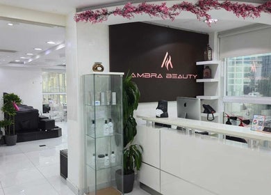 Reception area of Ambra Beauty, Abu Dhabi, AE, with modern decor and inviting atmosphere.