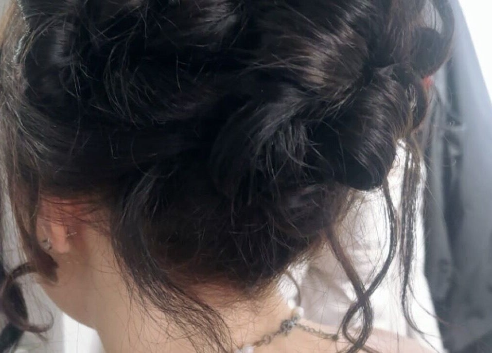 Intricate hair updo crafted at Nails by Sienna, Pontefract, England, GB, showcasing modern hairstyling.